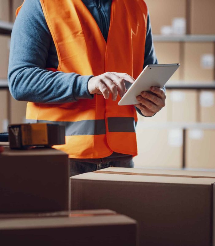 Warehouse operative using a tablet